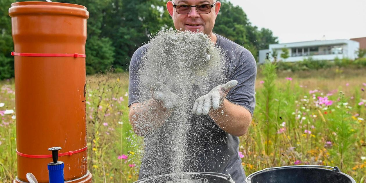 Photo: Man playfully throwing rock dust