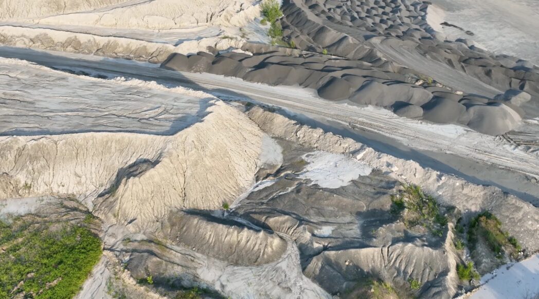 Quarry with piles of rock dust